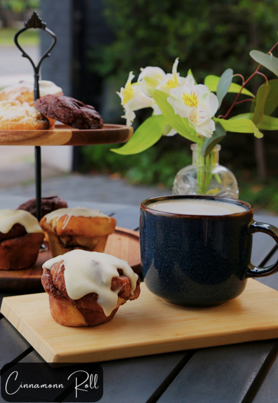 Cinnamon roll with icing served with coffee