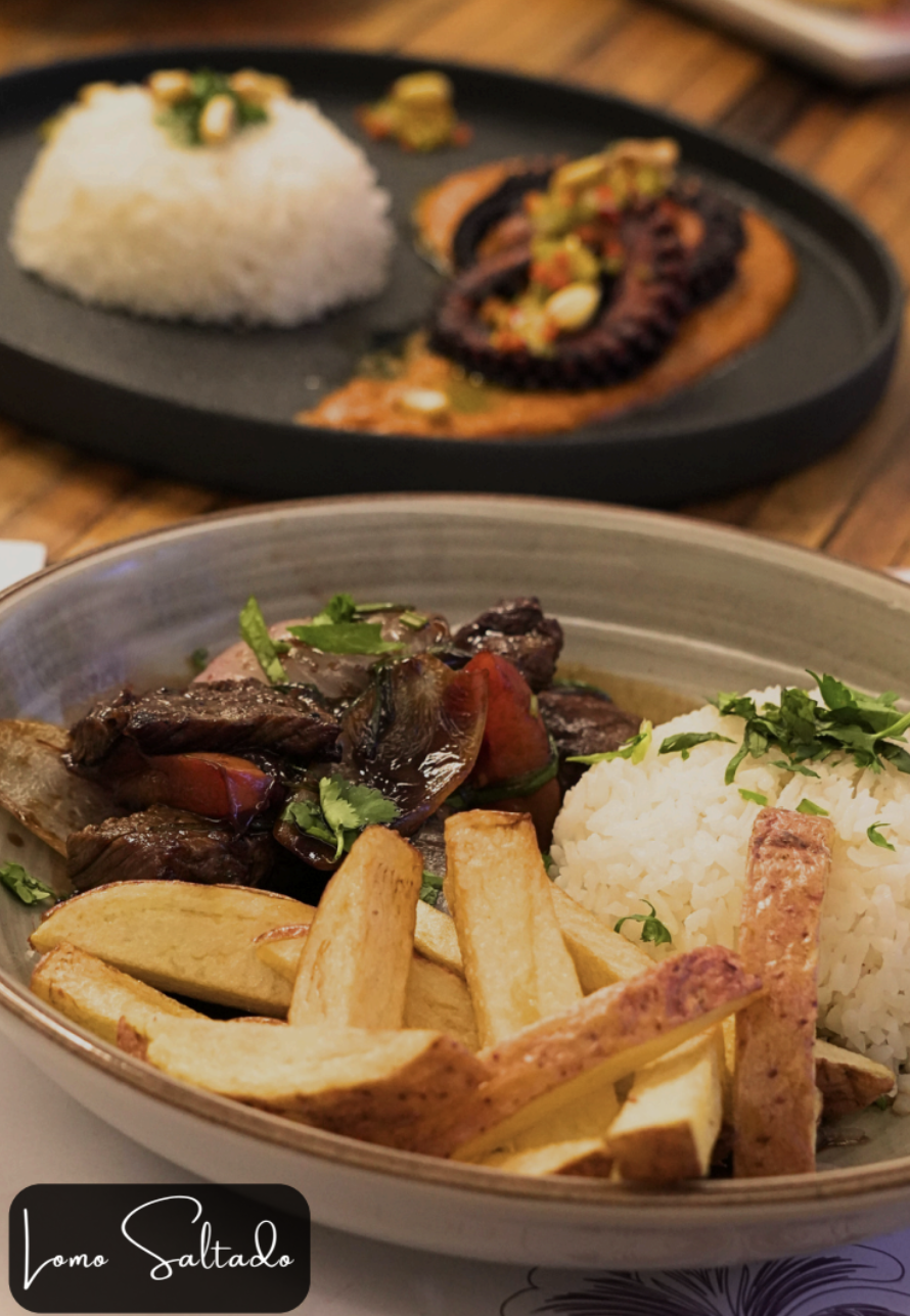 Classic Peruvian lomo saltado with rice and fries